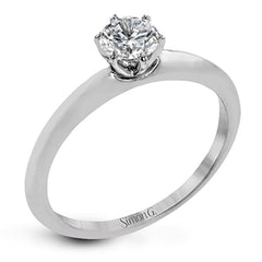 This contemporary, minimalist design in white gold is the perfect way to highlight a single round stone as a centerpiece.