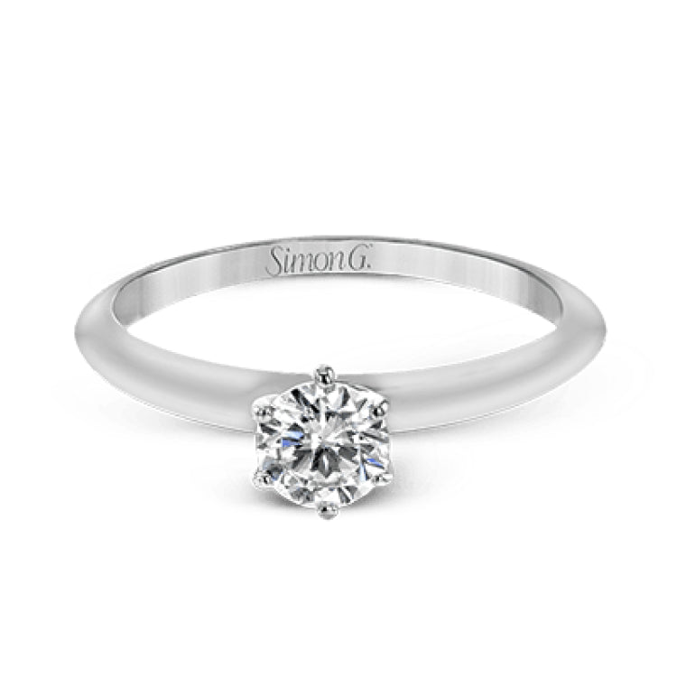 This contemporary, minimalist design in white gold is the perfect way to highlight a single round stone as a centerpiece.