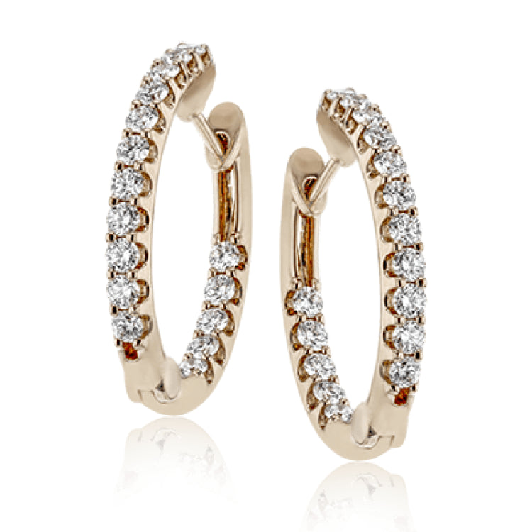 These elegant white gold earrings feature 1.95 ctw of white diamonds