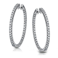 Dramatic yet refined, these white gold earrings contain 1.52 ctw of white diamonds