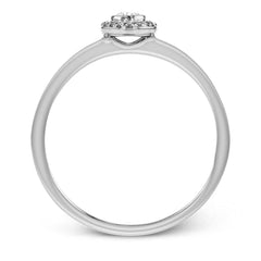 This exquisite, minimalist white gold ring features a halo containing .05 ctw of round white diamonds encircling a .17 ctw oval shaped white diamond