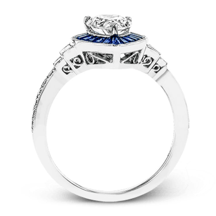 This beautiful pear-shaped setting displays .82 ctw of baguette sapphires in a halo around the center stone. The rest of the ring sparkles with .11 ctw of round diamonds and .17 ctw of baguette diamonds.