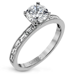 This sleek, minimalist white gold wedding set features a distinctive design with an impressive 1.05 ctw of baguette shaped white diamonds.