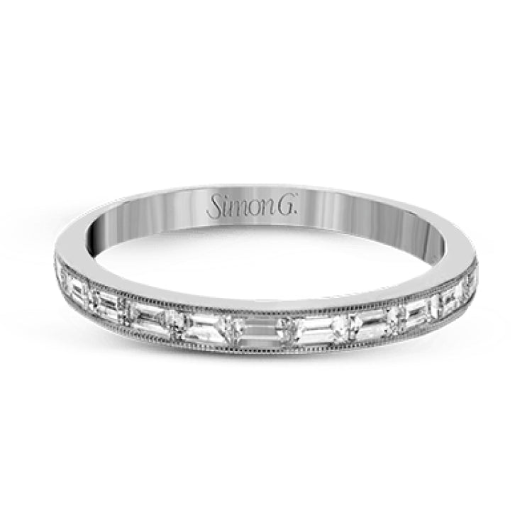 This sleek, minimalist white gold wedding set features a distinctive design with an impressive 1.05 ctw of baguette shaped white diamonds.