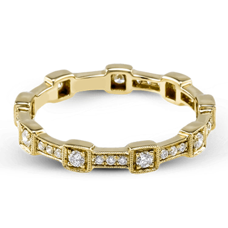 This yellow gold band form a modern style band set with .33 ctw of striking round cut white diamond accents. Perfect for stacking.