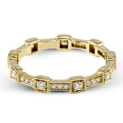 This yellow gold band form a modern style band set with .33 ctw of striking round cut white diamond accents. Perfect for stacking.