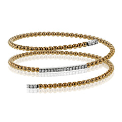 This delicate rose gold bangle hugs the wrist with its understated .42 ctw of white diamond accents in white gold. Perfect for stacking.