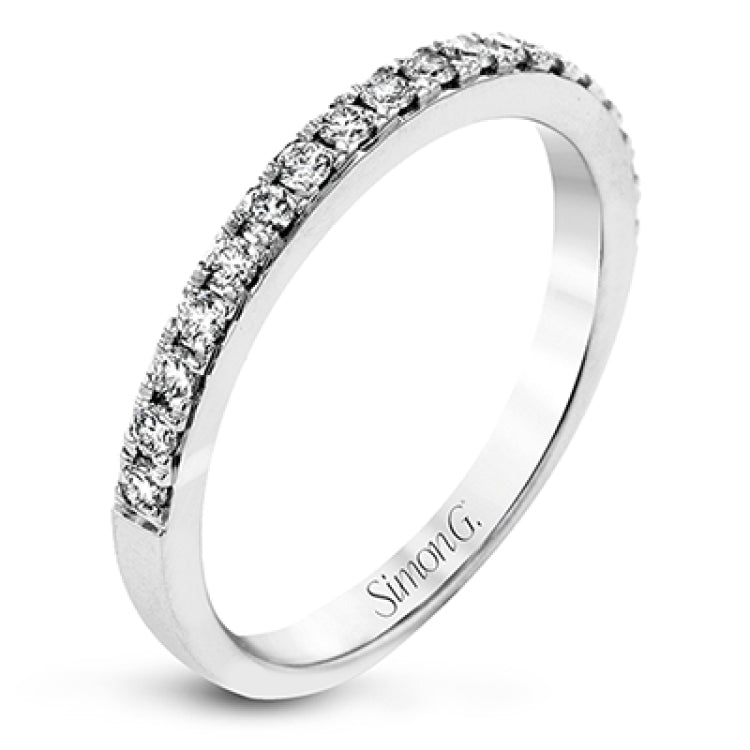 This white gold wedding set frames its centerpiece with .90 ctw of round white diamonds in a whimsical floral-inspired design.