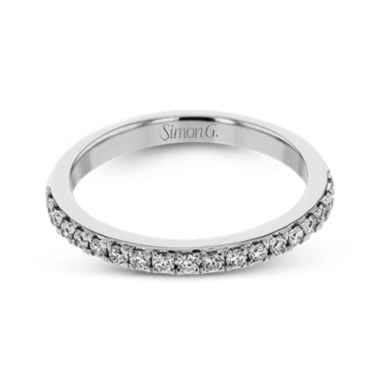 This white gold wedding set frames its centerpiece with .90 ctw of round white diamonds in a whimsical floral-inspired design.