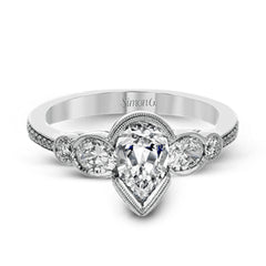 This lovely contemporary design features white gold and .14 ctw of round white diamonds and .42 ctw of oval shaped white diamonds as well as delicate milgrain edging around its centerpiece.