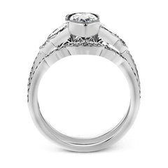 This lovely contemporary design features white gold and .14 ctw of round white diamonds and .42 ctw of oval shaped white diamonds as well as delicate milgrain edging around its centerpiece.