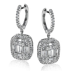 These lovely earrings feature a mosaic of smaller diamonds in the center, creating quite a statement! These 18k white gold earrings contain .41 ctw of round diamonds and .79 ctw of baguette diamonds.