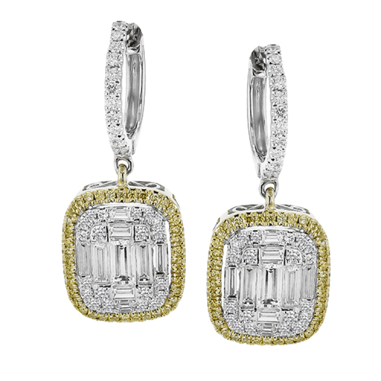 These lovely earrings feature a mosaic of smaller diamonds in the center, creating quite a statement! These 18k white gold earrings contain .41 ctw of round diamonds and .79 ctw of baguette diamonds.