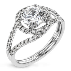 Crafted in the highest quality platinum, this engagement ring design features a two overlapping loops encircling the center stone set with .25 ctw of white diamonds.