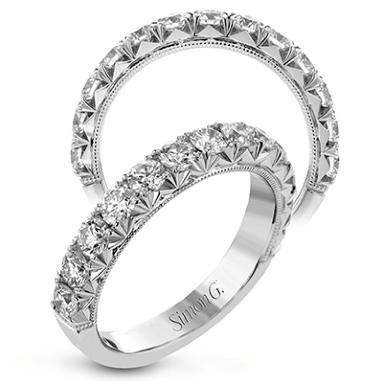 This classic wedding band features a distinctive setting style that shows off the .97 ctw of white diamonds to their full advantage.