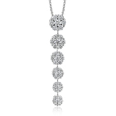 This simple, elegant white gold pendant sparkles with a total of 1.59 ctw of round white diamonds in descending clusters