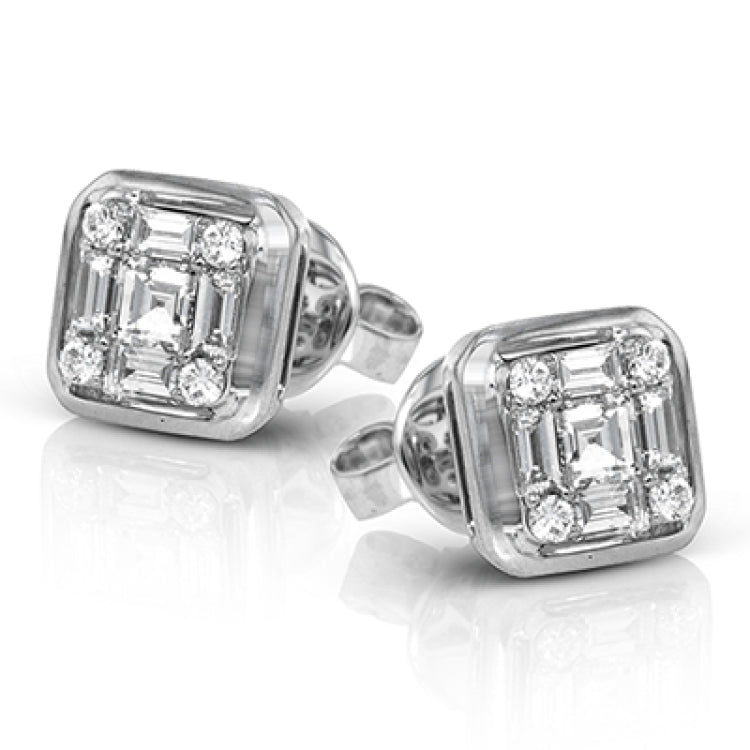 This square 18k white gold earrings are actually made up of 9 smaller diamonds, including .09 ctw round diamonds, .19 ctw princess cut diamonds, and .25 ctw baguette diamonds.