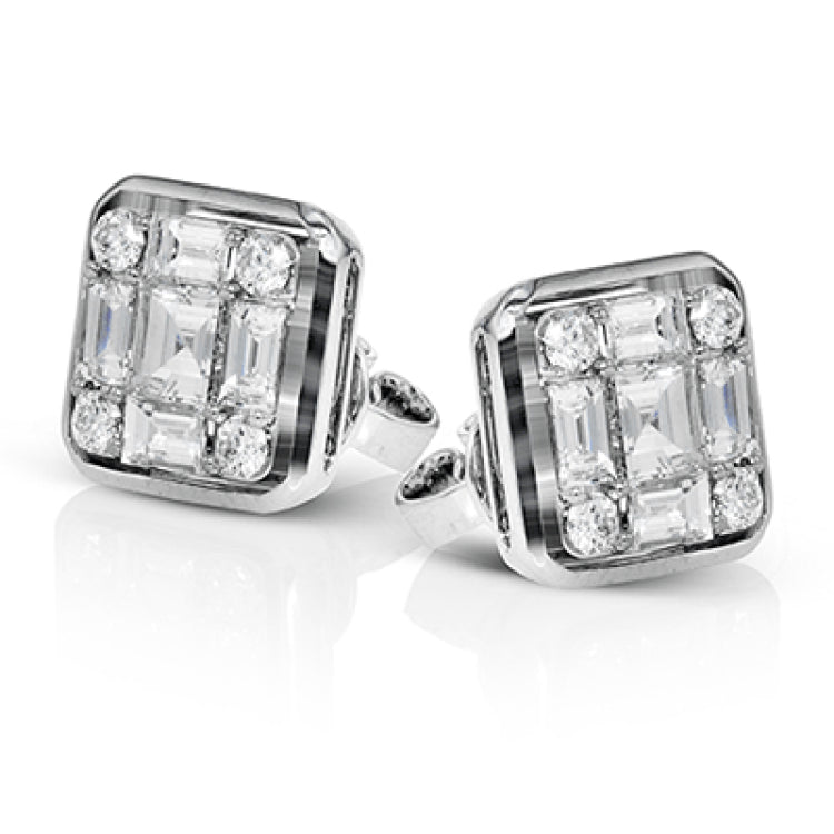 These statement stud earrings are made from 18k white gold and contains 9 smaller diamond which make up the larger look. These earrings contain .21 ctw of round diamonds, .49 ctw of princess cut diamonds, and .62 ctw of baguette diamonds.