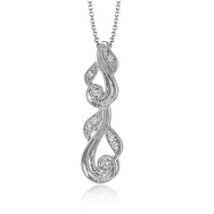 This 18k white gold pendant has a filigree design accented with vintage-inspired milgrain and .17 ctw of white round diamonds.