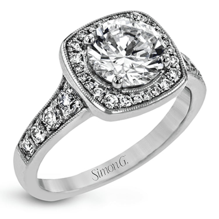 This exquisite white gold ring features a square halo and milgrain detail along with .49 ctw of round white diamond accents.