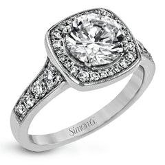 This exquisite white gold ring features a square halo and milgrain detail along with .49 ctw of round white diamond accents.