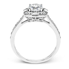 This sleek, contemporary white gold engagement ring contains .35 ctw of round white diamonds and .19 ctw of baguette shaped diamonds on its shank and unique, geometric halo