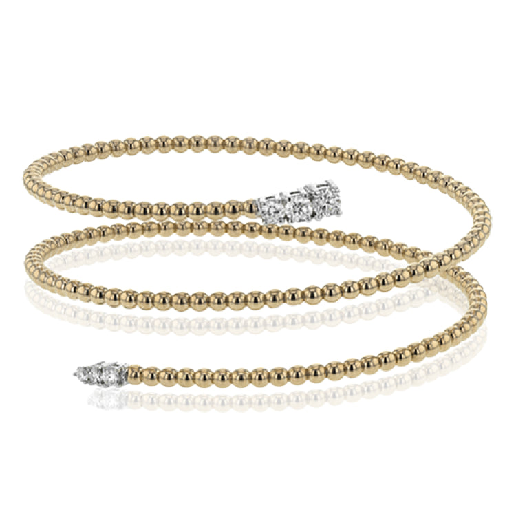 This spiral bangle look great stacked but also makes the perfect statement on its own. It contains a total of .54 ctw of white diamonds.