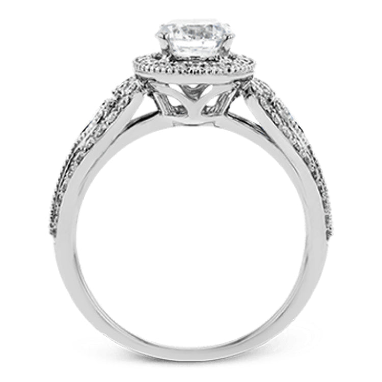 This intricate vintage-inspired engagement ring has two accent sapphire side stone totaling .25 ctw, while .33 ctw of white diamonds sparkle on the rest of the setting.