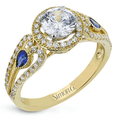 This intricate vintage-inspired engagement ring has two accent sapphire side stone totaling .25 ctw, while .33 ctw of white diamonds sparkle on the rest of the setting.