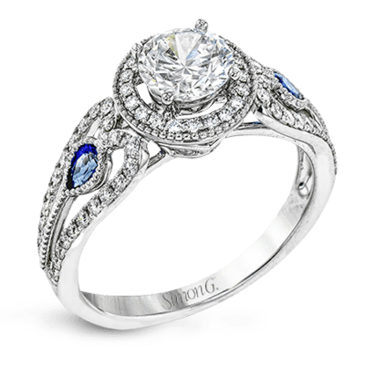 This intricate vintage-inspired engagement ring has two accent sapphire side stone totaling .25 ctw, while .33 ctw of white diamonds sparkle on the rest of the setting.