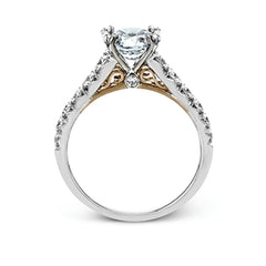 This beautiful white gold engagement ring is set with .55 ctw of round white diamonds flanking the center stone, as well as a distinctive rose gold accent