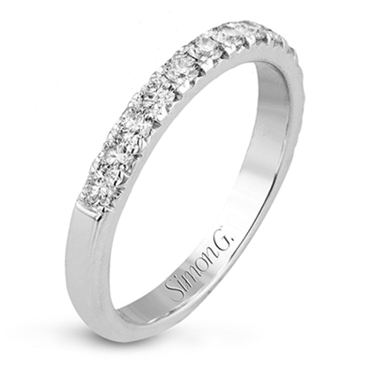 This beautiful white gold engagement ring is set with .55 ctw of round white diamonds flanking the center stone, as well as a distinctive rose gold accent