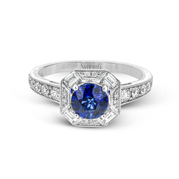 This lovely vintage-inspired setting features a geometric halo design containing .30 ctw of round diamonds, .18 ctw of baguette diamonds, and a center .96 ct sapphire.