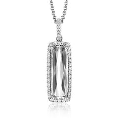 This sleek, vintage-inspired white gold pendant features .22 ctw of white diamonds framing a gorgeous 3.07ctw of green tourmaline