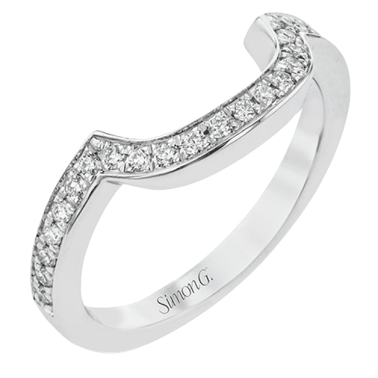 Specially shaped sapphires formed a halo around the center stone in this remarkable engagement ring, accented by .42 ctw of white diamonds as well.