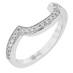 Specially shaped sapphires formed a halo around the center stone in this remarkable engagement ring, accented by .42 ctw of white diamonds as well.