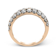 Simple yet elegant, this understated white gold band sparkles with 1.57 ctw of round white diamonds