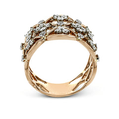 This unique rose gold band's striking openwork is accentuated by accents of white gold and .65 ctw of round white diamonds