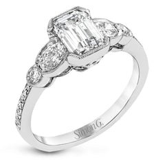 This lovely contemporary design features white gold and .16 ctw of round white diamonds and .39 ctw of oval shaped white diamonds as well as delicate milgrain edging around its centerpiece.