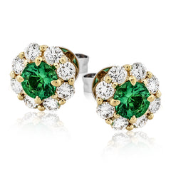 These lovely, vintage-inspired white gold earrings feature 1.15 ctw of sapphires framed by halos containing 1.17 ctw of round white diamonds.