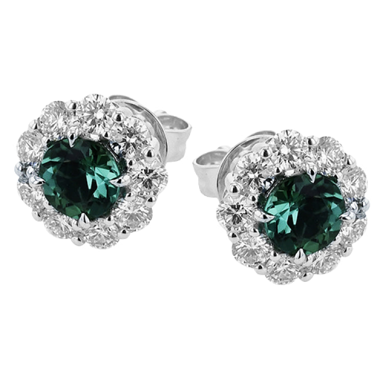 These lovely, vintage-inspired white gold earrings feature 1.15 ctw of sapphires framed by halos containing 1.17 ctw of round white diamonds.