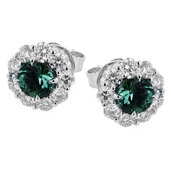 These lovely, vintage-inspired white gold earrings feature 1.15 ctw of sapphires framed by halos containing 1.17 ctw of round white diamonds.