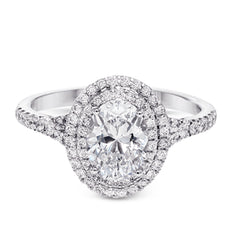This beautiful, classic style setting features a double halo design built for an oval center stone. It contains .40 ctw of side diamonds.