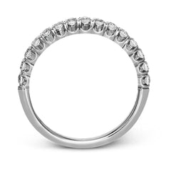 This classic wedding band contains a stunning .50 ctw of white round diamonds