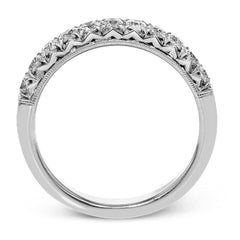 This classic wedding band features a distinctive setting style that shows off the .50 ctw of white diamonds to their full advantage.
