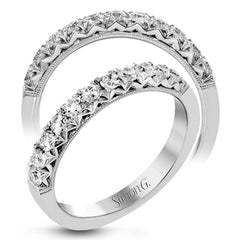 This classic wedding band features a distinctive setting style that shows off the .50 ctw of white diamonds to their full advantage.
