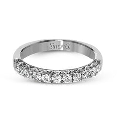 This classic wedding band features a distinctive setting style that shows off the .50 ctw of white diamonds to their full advantage.