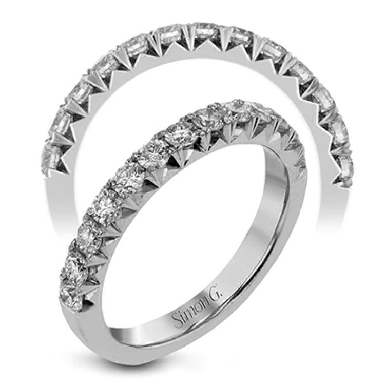This band pairs perfectly with an engagement ring, or can be worn on its own or stacked with other rings. It contains .75 ctw of white diamonds.