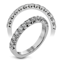 This band pairs perfectly with an engagement ring, or can be worn on its own or stacked with other rings. It contains .75 ctw of white diamonds.