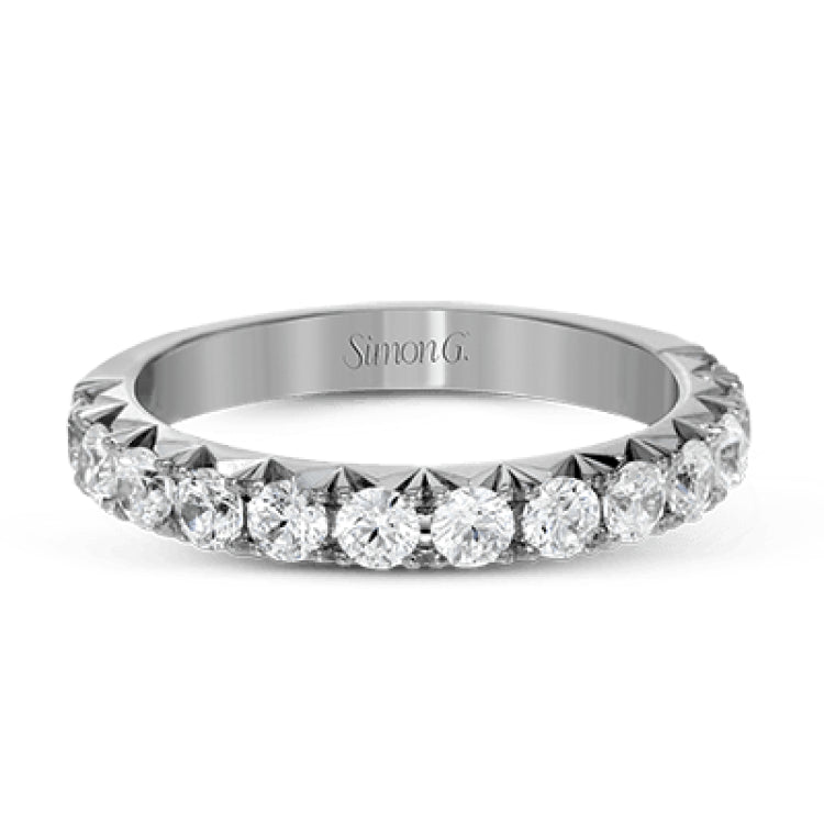 This band pairs perfectly with an engagement ring, or can be worn on its own or stacked with other rings. It contains .75 ctw of white diamonds.